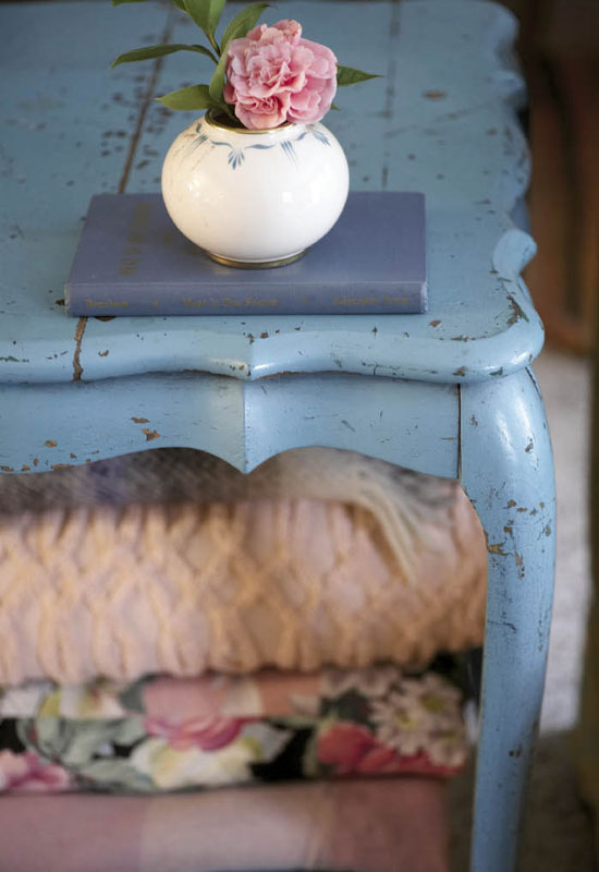  A worn turquoise side table bought off the back of a truck in Columbia.